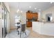 Cozy dining area with natural light, a glass table, and seating for two at 412 Mallard Way, Kissimmee, FL 34759