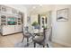 Cozy dining area with natural light, a glass table, and seating for two at 412 Mallard Way, Kissimmee, FL 34759