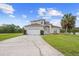 Charming two-story home with a well-manicured lawn and a spacious driveway at 412 Mallard Way, Kissimmee, FL 34759