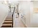 Welcoming foyer with staircase, tile flooring, and abundant natural light at 412 Mallard Way, Kissimmee, FL 34759