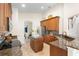 Elegant kitchen featuring granite countertops, stainless steel appliances, and a center island at 412 Mallard Way, Kissimmee, FL 34759