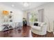 Sitting area featuring a decorative light fixture, chair, and views to the outside at 412 Mallard Way, Kissimmee, FL 34759