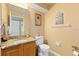 Bathroom with granite countertop, single sink, and a toilet at 425 Sterling Lake Dr, Ocoee, FL 34761
