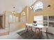 Dining room with an oval table, white chairs, and large windows at 425 Sterling Lake Dr, Ocoee, FL 34761