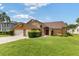 Charming two-story home with a well-manicured front yard, inviting entrance and two-car garage at 425 Sterling Lake Dr, Ocoee, FL 34761
