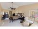 Spacious main bedroom with lounge area, neutral walls, and ceiling fan at 425 Sterling Lake Dr, Ocoee, FL 34761