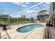 Screened in Pool featuring ample seating area and serene backyard view for summer relaxation at 425 Sterling Lake Dr, Ocoee, FL 34761