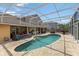 Relaxing screened pool with a patio and outdoor kitchen, ideal for entertaining at 425 Sterling Lake Dr, Ocoee, FL 34761