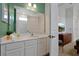 Bright bathroom with a large mirror, plenty of vanity space, and a modern, clean design at 4429 Ganesha Loop, Kissimmee, FL 34746