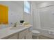 Bright bathroom showcasing a modern vanity, shower/tub combo, and contemporary fixtures at 4429 Ganesha Loop, Kissimmee, FL 34746