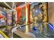 Game room featuring air hockey, video games and themed decorations for a fun entertainment experience at 4429 Ganesha Loop, Kissimmee, FL 34746