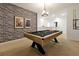 Game room featuring a pool table, exposed brick, and custom lighting at 4429 Ganesha Loop, Kissimmee, FL 34746