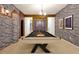 Game room featuring a modern pool table, unique decor, and modern lighting fixtures at 4429 Ganesha Loop, Kissimmee, FL 34746