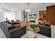 Large living room with stylish furnishings, a fireplace, modern décor, and marble floors at 4429 Ganesha Loop, Kissimmee, FL 34746