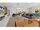Open concept living area with modern decor leads to the kitchen and dining areas at 4429 Ganesha Loop, Kissimmee, FL 34746