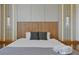 Clean, modern primary bedroom with soft lighting, pillows, and linens at 4429 Ganesha Loop, Kissimmee, FL 34746