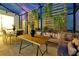 Outdoor patio area featuring dining table, chairs, couch, and decorative wall at 4429 Ganesha Loop, Kissimmee, FL 34746