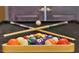 Close-up of pool table with colorful billiard balls arranged in a rack at 4429 Ganesha Loop, Kissimmee, FL 34746