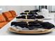Elegant table setting features gold chargers, black napkins, and white plates at 4429 Ganesha Loop, Kissimmee, FL 34746