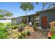 Back patio seating area with plants surrounding the firepit, creating a relaxing outdoor space at 524 S Lakeview Ave, Winter Garden, FL 34787