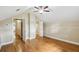 Spacious bedroom featuring hardwood floors, high ceilings, and convenient access to hallway and closet at 524 S Lakeview Ave, Winter Garden, FL 34787