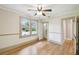 Comfortable bedroom featuring hardwood floors, natural light, and a walk-in closet at 524 S Lakeview Ave, Winter Garden, FL 34787