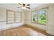 Inviting bedroom with hardwood floors, built-in shelving, and natural light at 524 S Lakeview Ave, Winter Garden, FL 34787