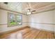 Bright, airy bedroom with hardwood floors, a ceiling fan, and natural light from the window at 524 S Lakeview Ave, Winter Garden, FL 34787