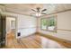 Bedroom features hardwood floors, ceiling fan, and multiple doors, offering versatile layout options at 524 S Lakeview Ave, Winter Garden, FL 34787