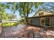 Spacious wooden deck, perfect for outdoor entertaining under a mature tree at 524 S Lakeview Ave, Winter Garden, FL 34787