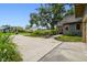 Long driveway with mature landscaping and a view of the home's charming exterior at 524 S Lakeview Ave, Winter Garden, FL 34787