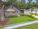 Charming single-Gathering home featuring a well-manicured lawn, blue siding, and a detached garage at 524 S Lakeview Ave, Winter Garden, FL 34787