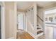 Inviting hallway with wood floors, staircase, and trim, showcasing a blend of classic design at 524 S Lakeview Ave, Winter Garden, FL 34787