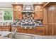 Modern kitchen featuring stainless steel appliances, custom cabinets, and a gas range at 524 S Lakeview Ave, Winter Garden, FL 34787
