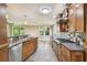 Spacious kitchen with stainless steel appliances, wood cabinetry, and modern finishes at 524 S Lakeview Ave, Winter Garden, FL 34787
