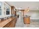 Spacious kitchen with wood cabinets, island, tile backsplash, and stainless steel appliances at 524 S Lakeview Ave, Winter Garden, FL 34787