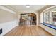 Bright living room featuring an arched entryway to the kitchen and a window seat at 524 S Lakeview Ave, Winter Garden, FL 34787