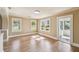Bright, open room with hardwood floors and large windows offering natural light at 524 S Lakeview Ave, Winter Garden, FL 34787