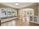Spacious living room with hardwood floors, built-in cabinets, and a cozy window seat at 524 S Lakeview Ave, Winter Garden, FL 34787