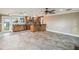 Bright living area with tile floors, and an open kitchen with a breakfast bar at 524 S Lakeview Ave, Winter Garden, FL 34787