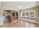 Charming dining area featuring an arched entryway to the kitchen and a window seat at 524 S Lakeview Ave, Winter Garden, FL 34787