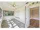Bright sun room featuring a ceiling fan, tile floors, and a doorway at 524 S Lakeview Ave, Winter Garden, FL 34787