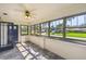 Bright sun room with a ceiling fan and several windows offering neighborhood views at 524 S Lakeview Ave, Winter Garden, FL 34787