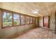 Charming sunroom with wood ceilings, terra-cotta tile, and ample natural light at 524 S Lakeview Ave, Winter Garden, FL 34787