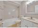 Full bathroom featuring a tiled shower/tub, single vanity, and toilet at 557 Hunter Cir, Kissimmee, FL 34758
