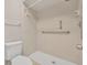Bathroom shower with accessible features including handrails and shower seat for convenience and safety at 557 Hunter Cir, Kissimmee, FL 34758