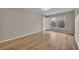 Spacious bedroom with wood floors, natural light, and neutral colors at 557 Hunter Cir, Kissimmee, FL 34758