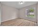 Bedroom featuring wood floors and a window view of the outdoors at 557 Hunter Cir, Kissimmee, FL 34758
