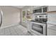 Bright kitchen with stainless steel appliances, subway tile backsplash, and breakfast nook at 557 Hunter Cir, Kissimmee, FL 34758