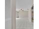 Bright, open living room with white tile floors and a ceiling fan at 557 Hunter Cir, Kissimmee, FL 34758